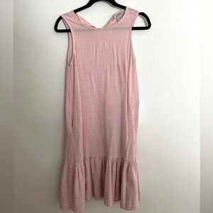 Pale pink a-line midi cotton dress with ruffle skirt and pockets